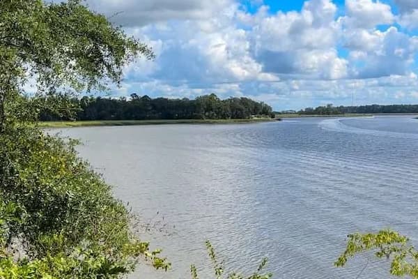 Bonaventure Cemetery riverside walk overlooking Wilmington River with ancient oaks and peaceful atmosphere