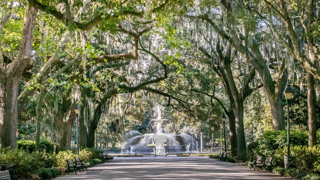Forsyth Park iconic fountain with historic Savannah architecture and manicured green spaces