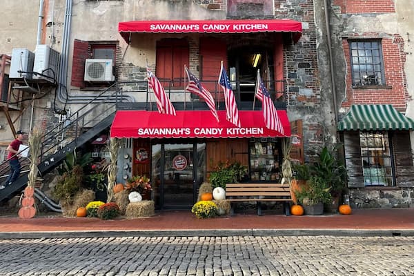 Savannah Candy Kitchen River Street storefront with handmade pralines and gourmet confections display