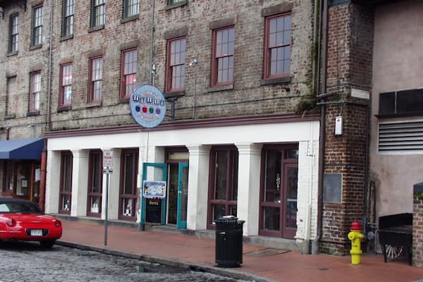 Wet Willie's River Street bar with lively atmosphere, tropical drinks, and Savannah River views