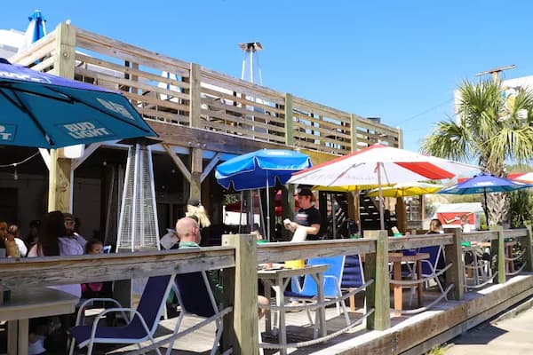 Tybee Island beach restaurants with outdoor seating, fresh seafood, and ocean views at sunset